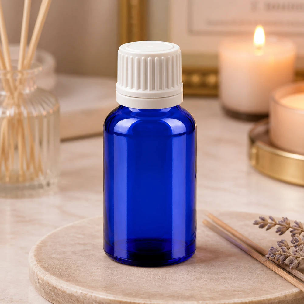 Frasco cuentagotas de 20 ml de alta calidad, de vidrio azul con protección UV y tapón de rosca blanco