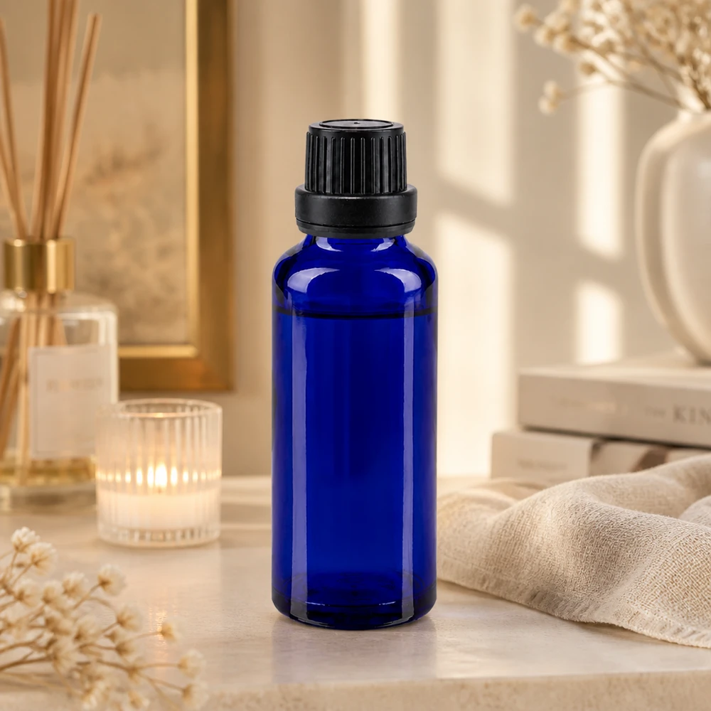 Frasco de 30 ml con cristal azul con protección UV y tapón de seguridad negro para cosméticos naturales