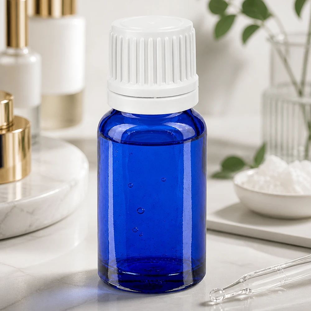 Frasco cuentagotas compacto de 10 ml en elegante azul con práctico tapón de rosca blanco