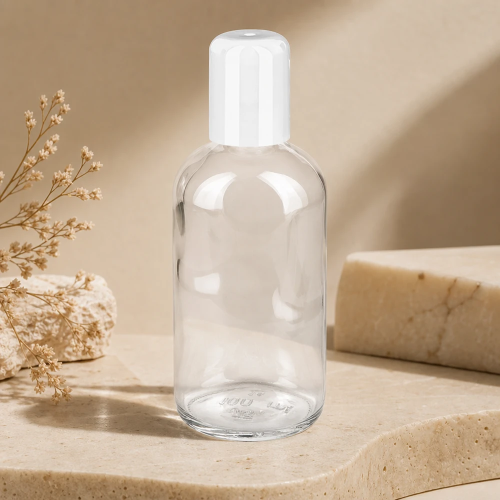 Frasco Roll-On 100ml blanco tapón estándar ClearLine UT18/100 Frasco roll-on ClearLine vacío de 100 ml con tapón abatible en color blanco sobre fondo de piedra natural