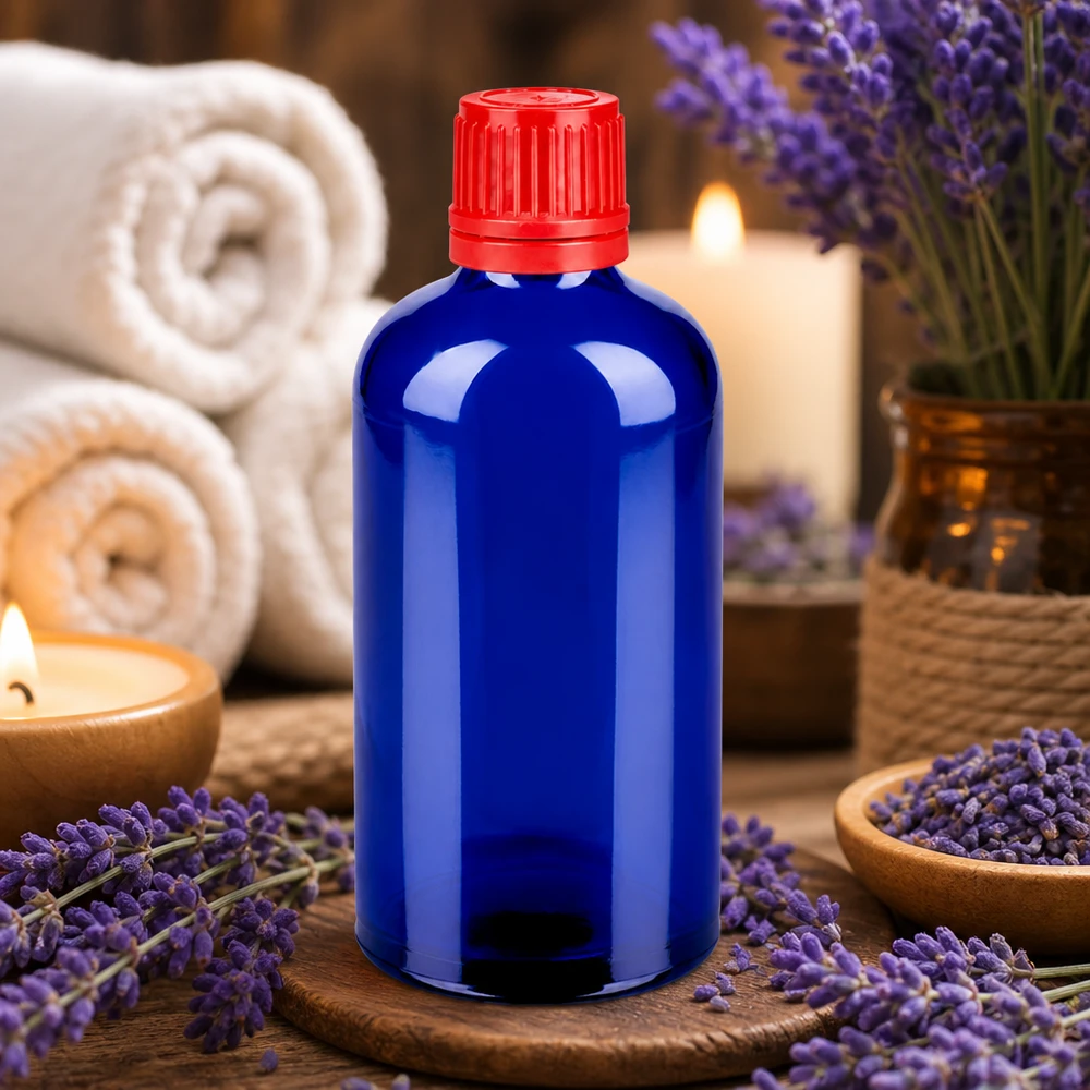 Frasco de aromaterapia de 100 ml azul cobalto con tapón rojo para aceites esenciales y bienestar