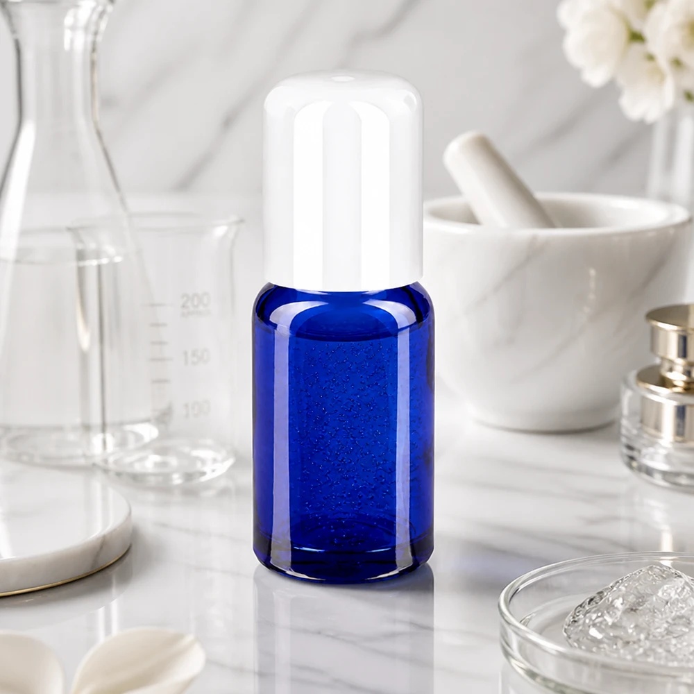Frasco roll-on de 10 ml STD BlueLine con aplicador de bola blanca para facilitar la dosificación