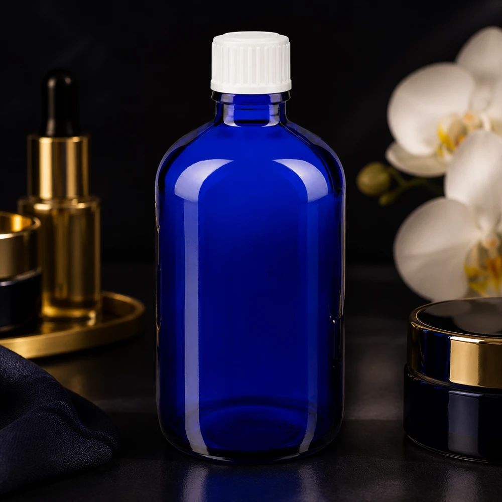 Frasco de cristal azul de 100 ml con tapón de seguridad infantil blanco para productos farmacéuticos y cosméticos