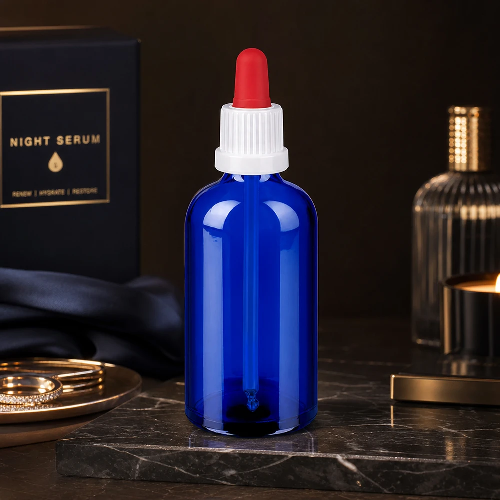 Frasco de vidrio fotoprotector de 100 ml en azul cobalto con tapón de pipeta para sustancias fotosensibles