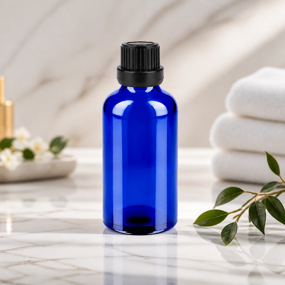 Elegante frasco de cristal azul de 50 ml con tapón de seguridad negro para cosméticos y aceites naturales