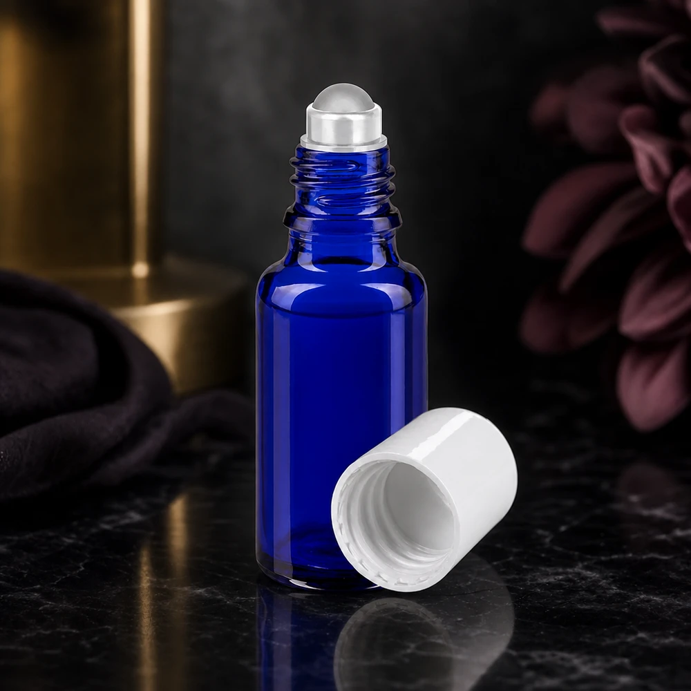 Frasco azul de 20 ml con aplicador de bola y tapón de rosca blanco, fabricado en vidrio de farmacia de alta calidad, con abertura lateral