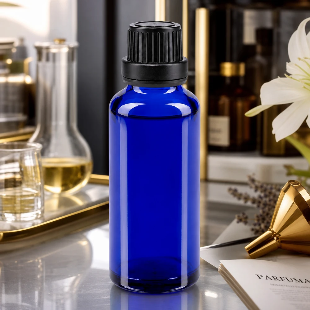 Frasco cuentagotas ApoGlas azul de 30 ml con boquilla de 2 mm y tapón negro para la elaboración de perfumes